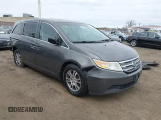 2012 Honda Odyssey EX-L with VIN 5FNRL5H65CB042898, listed as a IAAI auction lot 41784075 with 179,596 mi miles and . Bid and sale history available at carsss.com. Image 1.