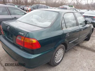 2000 Honda Civic LX with VIN 1HGEJ6673YL069805, listed as a IAAI auction lot 41511192 with 80,097 mi miles. Bid and sale history available at carsss.com. Image 4.