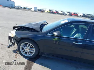 2013 Chevrolet Impala LTZ with VIN 2G1WC5E3XD1237776, listed as a IAAI auction lot 42023033 with 143,279 mi miles and . Bid and sale history available at DreamBid. Image 14.