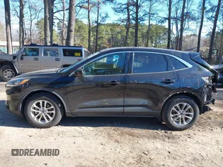 2020 Ford Escape SE z VIN 1FMCU0G6XLUA07056, wystawiony jako IAAI lot #41156940 z przebiegiem 103 707 mil mil oraz . Historia ofert i sprzedaży dostępna na DreamBid. Obrazek 14.
