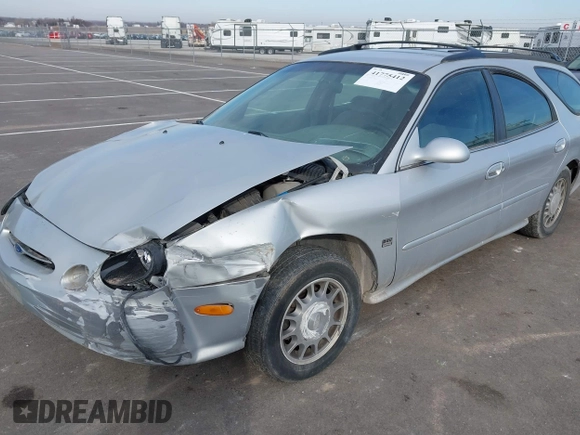 1999 Ford Taurus SE z VIN 1FAFP58S4XA299009, wystawiony jako IAAI lot #41775412 z przebiegiem 80 634 mil mil oraz . Historia ofert i sprzedaży dostępna na DreamBid. Obrazek 2.