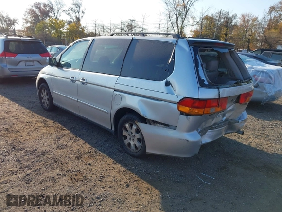 2004 Honda Odyssey EX-L with VIN 5FNRL18964B025323, listed as a IAAI auction lot 40714457 with 164,786 mi miles and . Bid and sale history available at DreamBid. Image 3.
