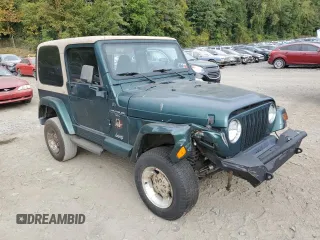 2000 Jeep Wrangler Sahara with VIN 1J4FA59S1YP747919, listed as a Copart auction lot 72278044 with 157,360 mi miles and Salvage Title. Bid and sale history available at carsss.com. Image 4.