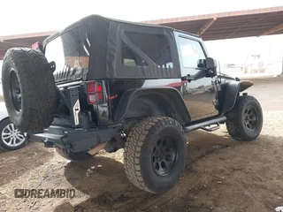 2011 Jeep Wrangler Rubicon with VIN 1J4BA6D13BL545343, listed as a IAAI auction lot 40980056 with 107,207 mi miles and . Bid and sale history available at carsss.com. Image 4.