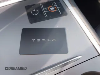 2023 Tesla Model Y Performance with VIN 7SAYGDEF3PF711497, listed as a IAAI auction lot 41877450 with 21,887 mi miles and . Bid and sale history available at DreamBid. Image 11.