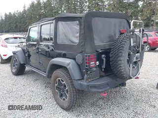 2015 Jeep Wrangler Unlimited Rubicon Hard Rock with VIN 1C4HJWFG6FL757421, listed as a IAAI auction lot 42107514 with 63,997 mi miles and . Bid and sale history available at DreamBid. Image 3.