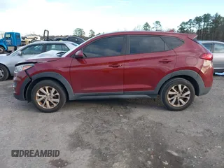 2019 Hyundai Tucson SE with VIN KM8J2CA49KU881841, listed as a IAAI auction lot 41099575 with 129,153 mi miles. Bid and sale history available at carsss.com. Image 14.