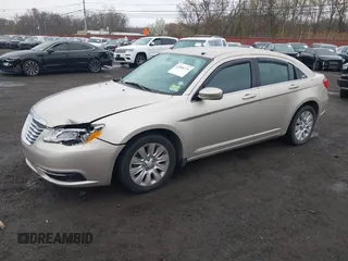2014 Chrysler 200 LX with VIN 1C3CCBAB2EN213983, listed as a IAAI auction lot 42006774 with 80,615 mi miles and . Bid and sale history available at carsss.com. Image 2.