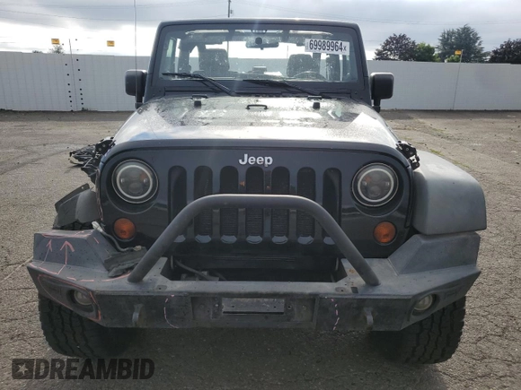 2011 Jeep Wrangler Rubicon with VIN 1J4BA6D12BL507652, listed as a Copart auction lot 69989964 with 127,493 mi miles and Salvage title. Bid and sale history available at DreamBid. Image 5.