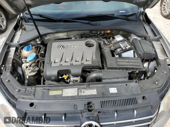 2014 Volkswagen Passat SEL Premium z VIN 1VWCN7A35EC073576, wystawiony jako Copart lot #52810825 z przebiegiem 113 067 mil mil oraz Szkoda całkowita • Salvage title. Historia ofert i sprzedaży dostępna na DreamBid. Obrazek 12.