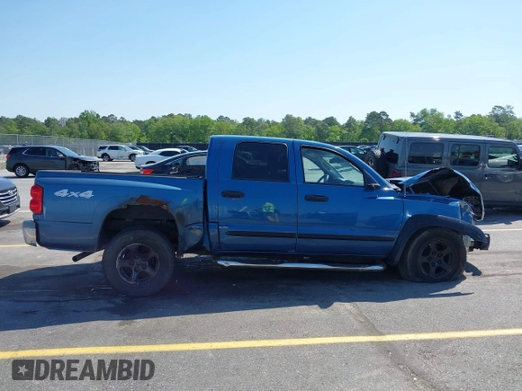 2005 Dodge Dakota SLT with VIN 1D7HW48N05S319621, listed as a IAAI auction lot 42037140 with 251,595 mi miles and . Bid and sale history available at DreamBid. Image 13.