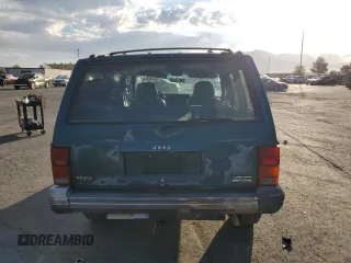 1995 Jeep Cherokee Country with VIN 1J4FJ78S5SL636284, listed as a Copart auction lot 76145234 with 104,048 mi miles and Salvage Title. Bid and sale history available at carsss.com. Image 6.