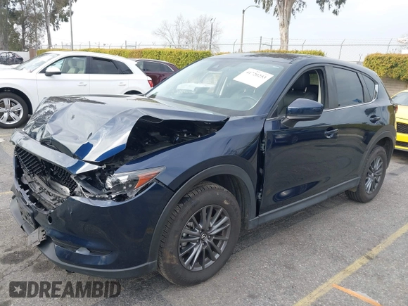 2019 Mazda CX-5 Touring with VIN JM3KFACM5K0697137, listed as a IAAI auction lot 41720253 with 50,416 mi miles. Bid and sale history available at carsss.com. Image 2.