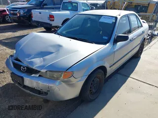 2001 Mazda Protege DX with VIN JM1BJ222810410482, listed as a IAAI auction lot 40799727 with 159,446 mi miles and . Bid and sale history available at DreamBid. Image 2.