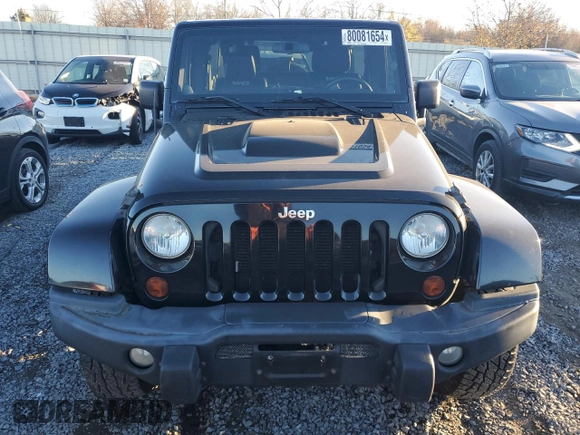 2012 Jeep Wrangler Unlimited Rubicon with VIN 1C4HJWFG1CL221083, listed as a Copart auction lot 80081654 with 163,912 mi miles and Salvage title. Bid and sale history available at DreamBid. Image 5.