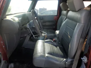 2009 Jeep Wrangler X with VIN 1J4FA24119L756089, listed as a Copart auction lot 56953205 with 158,157 mi miles and Salvage title. Bid and sale history available at DreamBid. Image 7.