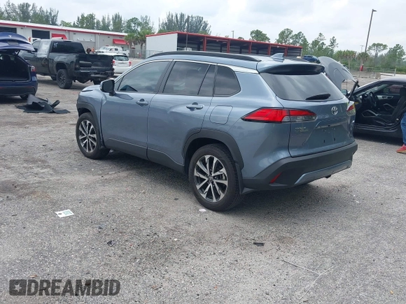 2023 Toyota Corolla Cross XLE with VIN 7MUDAAAGXPV070263, listed as a IAAI auction lot 42394307 with 18,977 mi miles and . Bid and sale history available at DreamBid. Image 3.