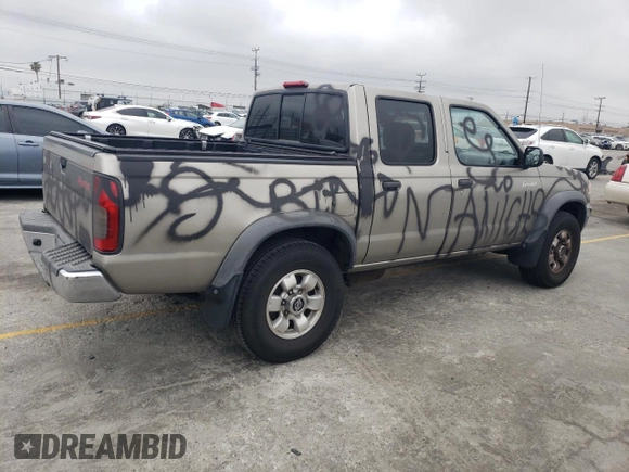 2000 Nissan Frontier XE with VIN 1N6ED27T8YC357939, listed as a Copart auction lot 55727395 with 143,842 mi miles and Salvage title. Bid and sale history available at DreamBid. Image 3.