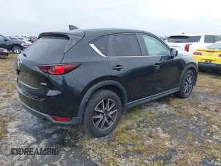 2018 Mazda CX-5 Touring with VIN JM3KFACM0J0315739, listed as a IAAI auction lot 40516262 with 60,727 mi miles. Bid and sale history available at carsss.com. Image 4.