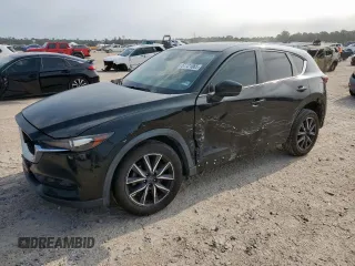 2018 Mazda CX-5 Touring z VIN JM3KFACM7J1390786, wystawiony jako Copart lot #57721065 z przebiegiem 87 765 mil mil oraz Szkoda całkowita • Salvage title. Historia ofert i sprzedaży dostępna na DreamBid. Obrazek 1.