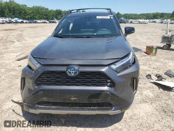 2023 Toyota RAV4 Hybrid XSE with VIN 2T3E6RFV9PW039963, listed as a Copart auction lot 57594335 with 27,486 mi miles and Salvage title. Bid and sale history available at DreamBid. Image 5.