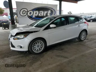 2014 Ford Focus Titanium with VIN 1FADP3N29EL224842, listed as a Copart auction lot 60297345 with 121,105 mi miles and Salvage title. Bid and sale history available at DreamBid. Image 1.