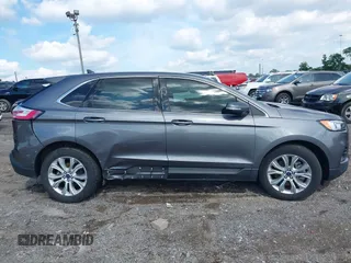 2021 Ford Edge Titanium z VIN 2FMPK3K9XMBA21766, wystawiony jako IAAI lot #42187940 z przebiegiem 79 732 mil mil oraz . Historia ofert i sprzedaży dostępna na DreamBid. Obrazek 13.