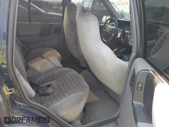 1994 Jeep Grand Cherokee Laredo z VIN 1J4GZ58Y7RC233746, wystawiony jako IAAI lot #42722206 z przebiegiem 196 875 mil mil oraz . Historia ofert i sprzedaży dostępna na DreamBid. Obrazek 8.