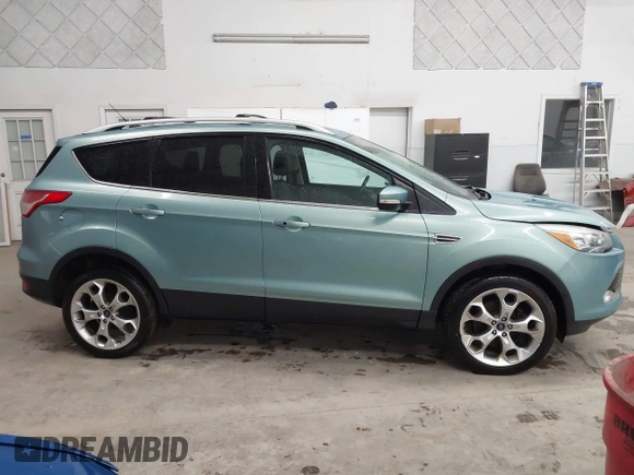 2013 Ford Escape Titanium with VIN 1FMCU9J9XDUC60029, listed as a IAAI auction lot 41936948 with 184,012 mi miles and . Bid and sale history available at DreamBid. Image 13.