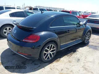 2018 Volkswagen Beetle Dune with VIN 3VWSD7AT1JM702354, listed as a IAAI auction lot 41993527 with 50,952 mi miles and . Bid and sale history available at DreamBid. Image 4.