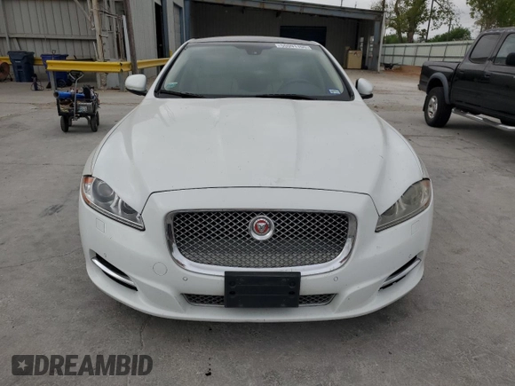 2014 Jaguar XJ Portfolio with VIN SAJWJ2GD6E8V65987, listed as a Copart auction lot 50091105 with 136,080 mi miles and Clean title. Bid and sale history available at DreamBid. Image 5.