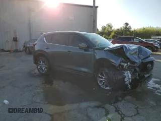 2019 Mazda CX-5 Grand Touring with VIN JM3KFBDM9K0676795, listed as a Copart auction lot 52129885 with 71,869 mi miles and Salvage Title. Bid and sale history available at carsss.com. Image 4.