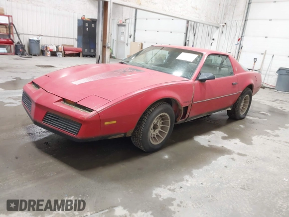 1983 Pontiac Firebird z VIN 1G2AW87H3DN205080, wystawiony jako IAAI lot #41603586 z przebiegiem 83 350 mil mil oraz . Historia ofert i sprzedaży dostępna na DreamBid. Obrazek 2.
