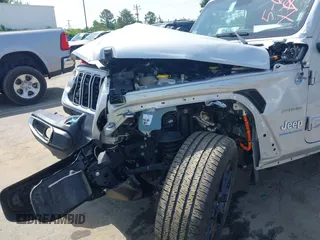 2024 Jeep Wrangler Sahara with VIN 1C4RJXP60RW292136, listed as a IAAI auction lot 42280063 with 26,701 mi miles and . Bid and sale history available at DreamBid. Image 18.