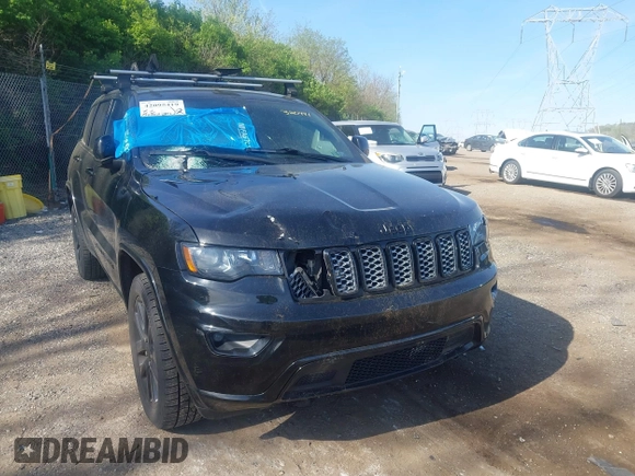 2018 Jeep Grand Cherokee Laredo E with VIN 1C4RJFAG2JC320441, listed as a IAAI auction lot 42095419 with 136,962 mi miles. Bid and sale history available at carsss.com. Image 6.
