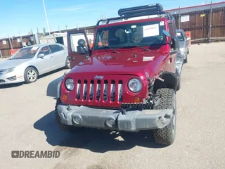 2013 Jeep Wrangler Sport with VIN 1C4AJWAG3DL608342, listed as a IAAI auction lot 41858662 with 118,504 mi miles and . Bid and sale history available at DreamBid. Image 12.