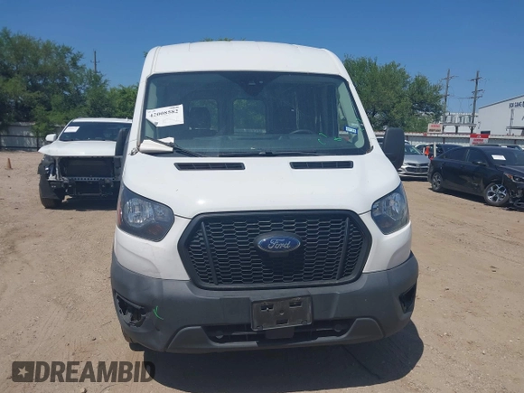 2021 Ford Transit Cargo with VIN 1FTBR1C8XMKA64837, listed as a IAAI auction lot 42008582 with 74,562 mi miles and . Bid and sale history available at DreamBid. Image 12.