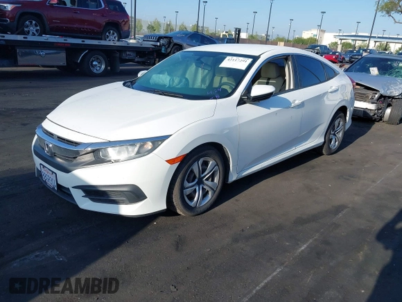 2018 Honda Civic LX with VIN 2HGFC2F56JH502770, listed as a IAAI auction lot 42117291 with 60,651 mi miles and . Bid and sale history available at DreamBid. Image 2.