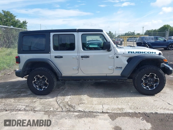 2023 Jeep Wrangler Rubicon with VIN 1C4JJXR63PW703424, listed as a IAAI auction lot 42639653 with 46,412 mi miles and . Bid and sale history available at DreamBid. Image 12.