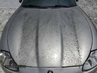1999 Jaguar XK z VIN SAJGX2049XC034022, wystawiony jako Copart lot #55690025 z przebiegiem Nie podano mil oraz Tytuł czysty. Historia ofert i sprzedaży dostępna na DreamBid. Obrazek 11.