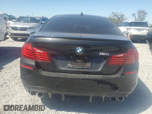 2014 BMW M5 z VIN WBSFV9C52ED593005, wystawiony jako Copart lot #49054395 z przebiegiem 71 213 mil mil oraz Szkoda całkowita • Salvage title. Historia ofert i sprzedaży dostępna na DreamBid. Obrazek 6.