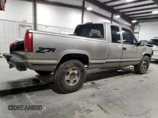1998 Chevrolet Silverado 1500 with VIN 2GCEK19R9W1105382, listed as a Copart auction lot 87264814 with 290,006 mi miles and Salvage Title. Bid and sale history available at DreamBid. Image 3.