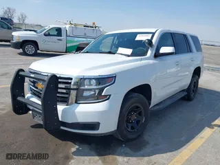 2020 Chevrolet Tahoe Commercial with VIN 1GNSKDEC5LR261015, listed as a IAAI auction lot 42001083 with 110,668 mi miles. Bid and sale history available at carsss.com. Image 18.