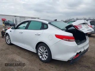 2016 Kia Optima EX with VIN 5XXGU4L31GG027250, listed as a IAAI auction lot 41881343 with 135,635 mi miles. Bid and sale history available at carsss.com. Image 3.