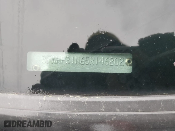 2005 Ford Focus with VIN 3FAHP31N65R146202, listed as a Copart auction lot 50226415 with 184,919 mi miles and Salvage title. Bid and sale history available at DreamBid. Image 12.