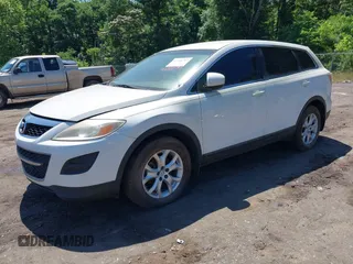 2012 Mazda CX-9 Sport z VIN JM3TB2BA6C0361981, wystawiony jako IAAI lot #42320797 z przebiegiem 152 239 mil mil oraz . Historia ofert i sprzedaży dostępna na DreamBid. Obrazek 2.
