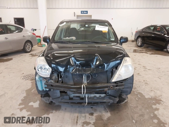2009 Nissan Versa 1.8 S with VIN 3N1BC11E99L438342, listed as a IAAI auction lot 41561812 with 152,141 mi miles. Bid and sale history available at carsss.com. Image 13.