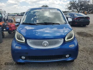 2016 Smart fortwo Passion z VIN WMEFJ5DA5GK058855, wystawiony jako Copart lot #57119445 z przebiegiem 173 493 mil mil oraz Szkody całkowita. Historia ofert i sprzedaży dostępna na DreamBid. Obrazek 5.