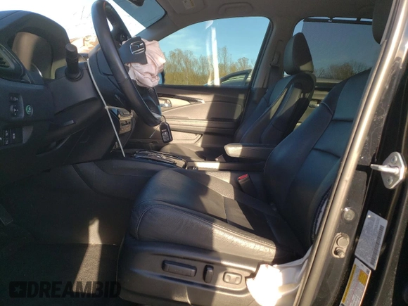 2021 Honda Pilot Touring 8-Passenger with VIN 5FNYF5H94MB039974, listed as a Copart auction lot 82654964 with 54,048 mi miles and Salvage Title. Bid and sale history available at DreamBid. Image 7.