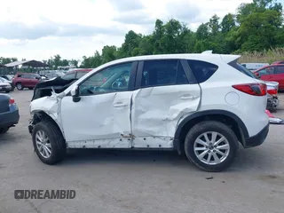 2014 Mazda CX-5 Touring z VIN JM3KE4CY9E0373359, wystawiony jako IAAI lot #42209277 z przebiegiem 106 493 mil mil oraz . Historia ofert i sprzedaży dostępna na DreamBid. Obrazek 15.